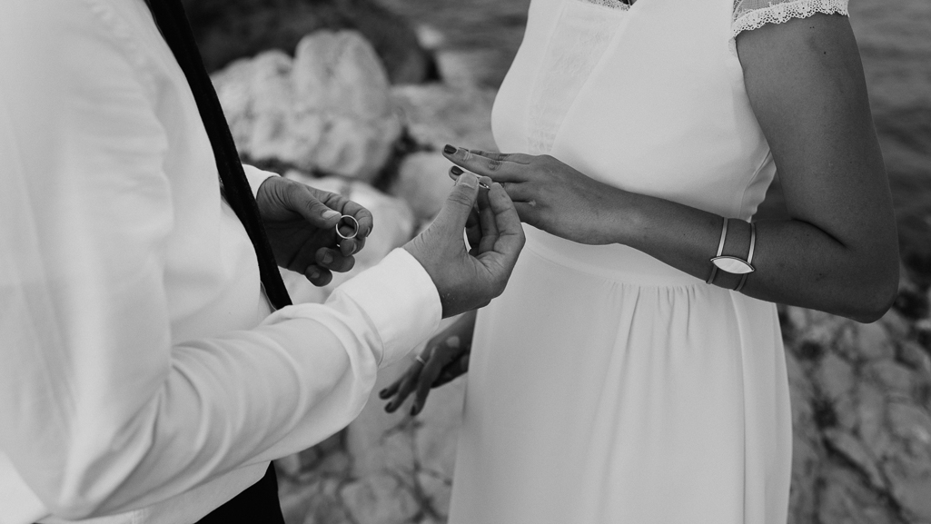 Ring exchange during intimate wedding in Valencia, Spain.