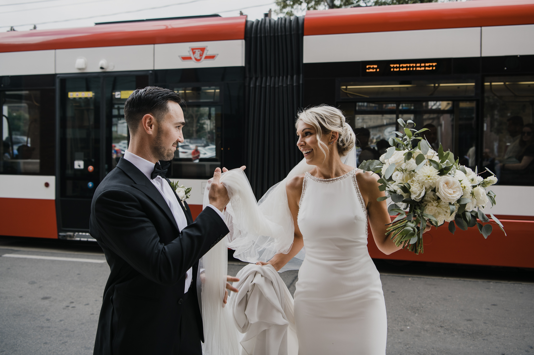 Bride and Groom in front of Toronto Streetcar outside Broadview Hotel Wedding