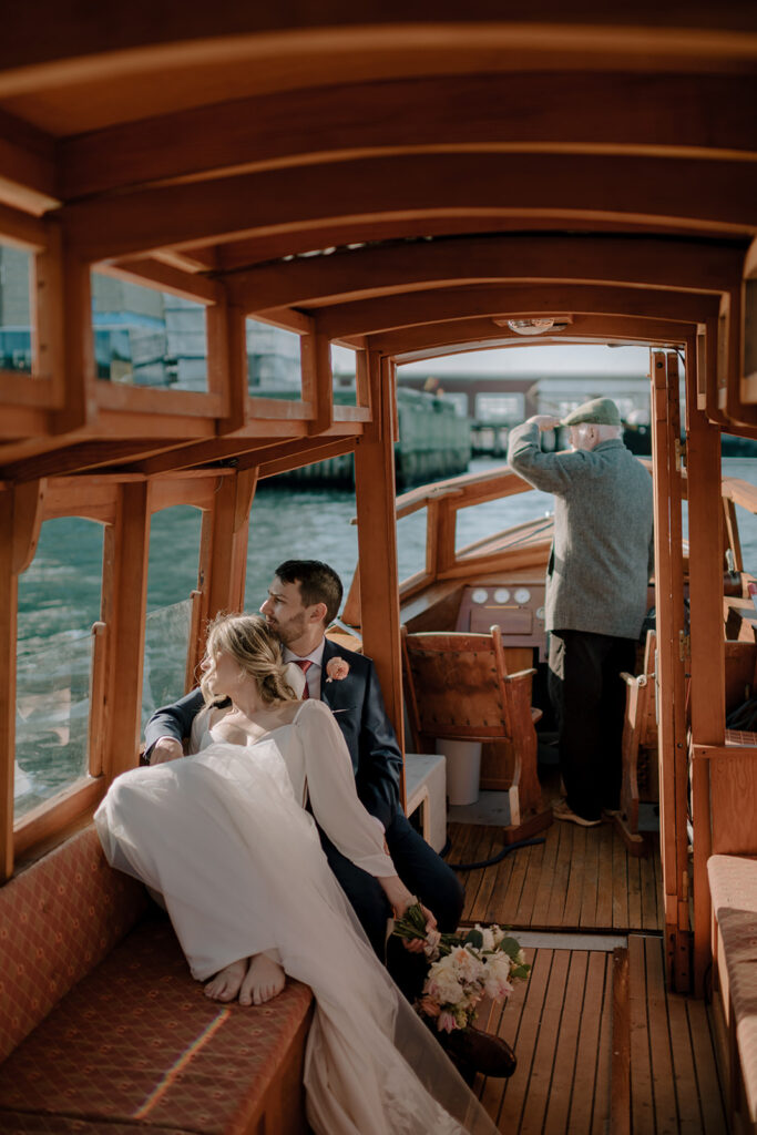 Wedding couple sitting on boat in Halifax Harbour