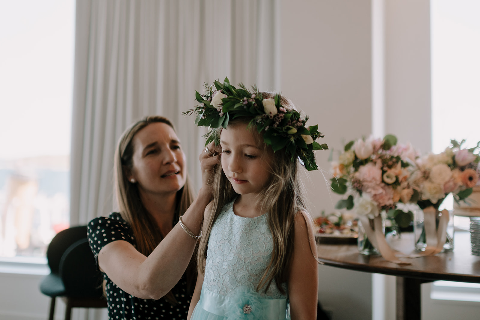 Mother putting flower crown on flower girl at Muir wedding in Halifax