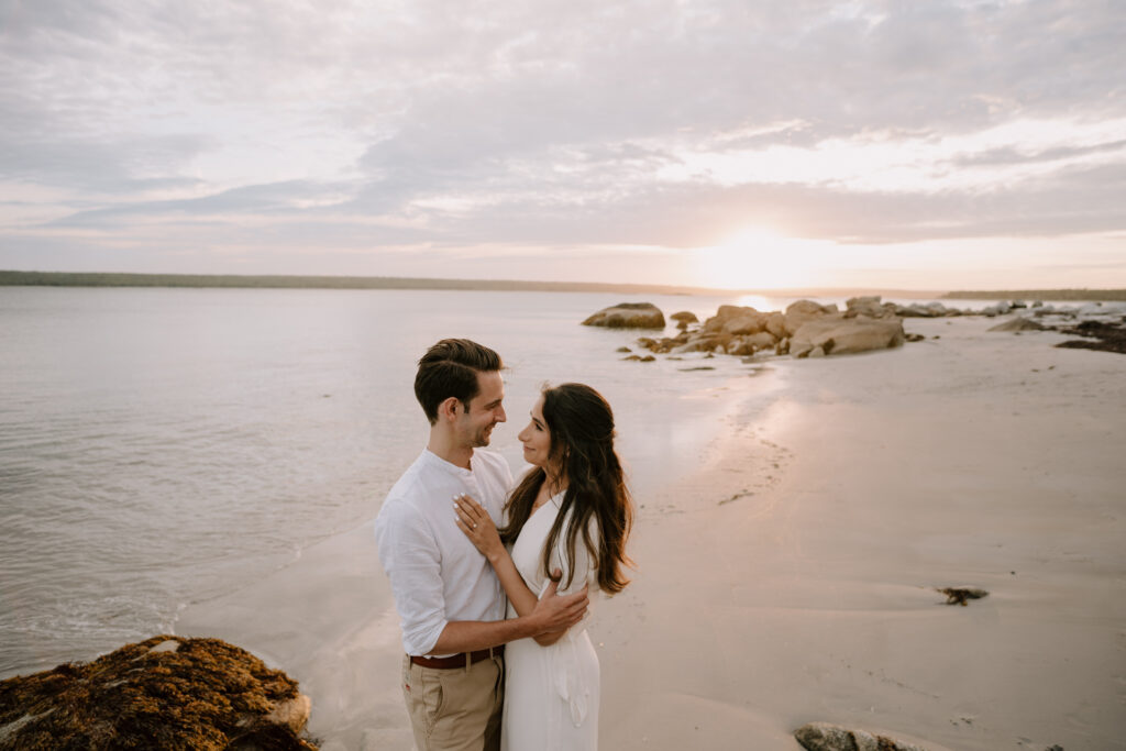 Intimate moment of wedding couple gazing into each other's eyes at Bull Point Estates. Photographed by Nova Scotia Wedding Photographer.