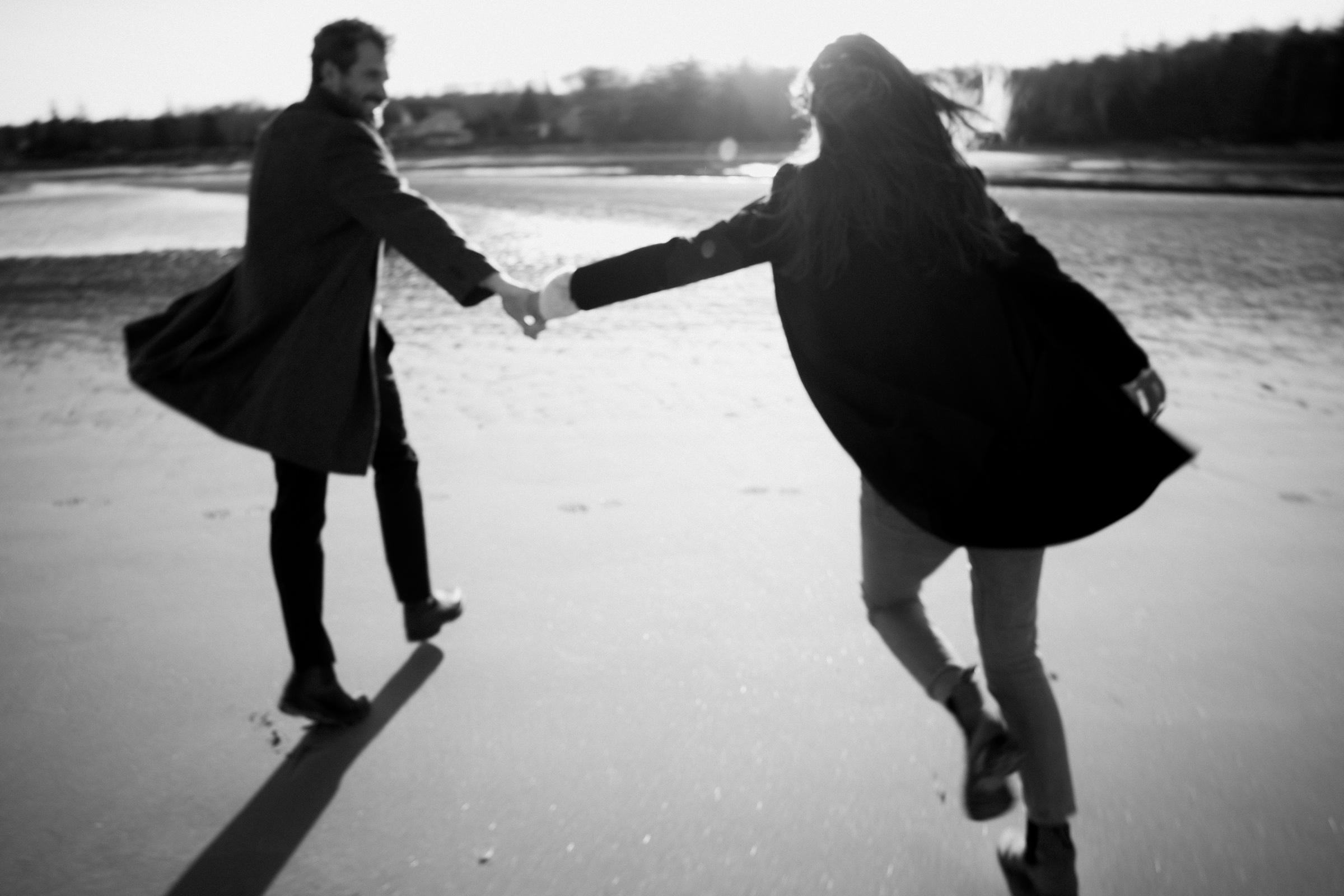 Couple running on Nova Scotian Beach