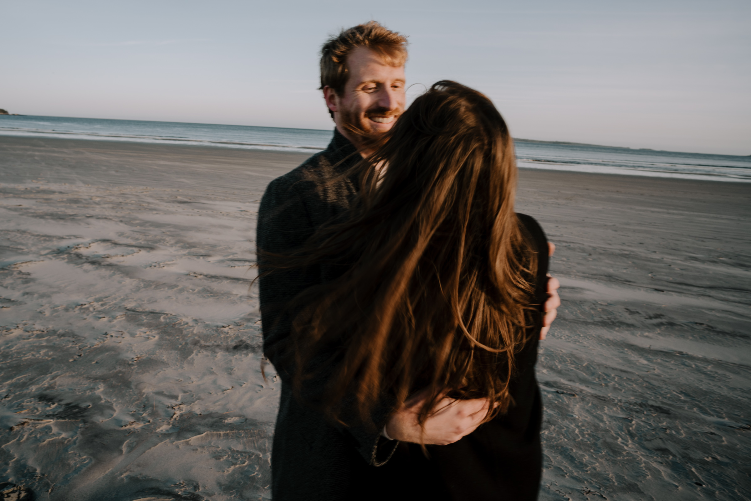 Couple laughing on Beach in Nova Scotia