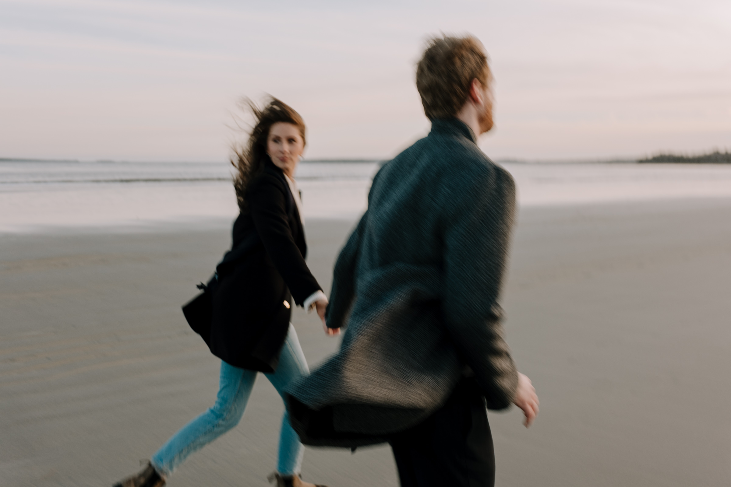 Couple running on Nova Scotian Beach