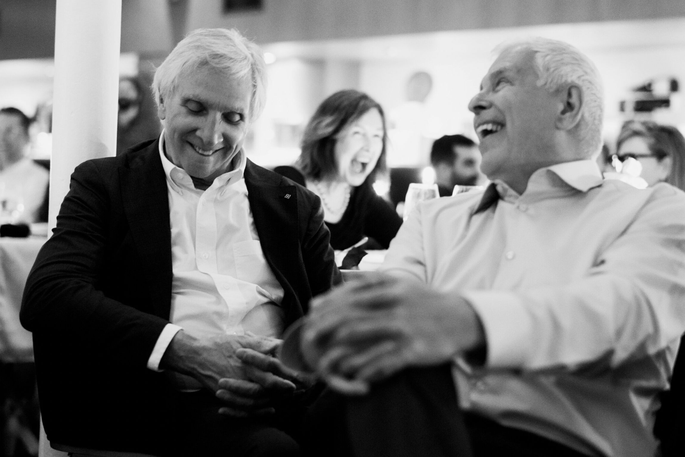 Two men laughing at Pazzo wedding in Halifax.